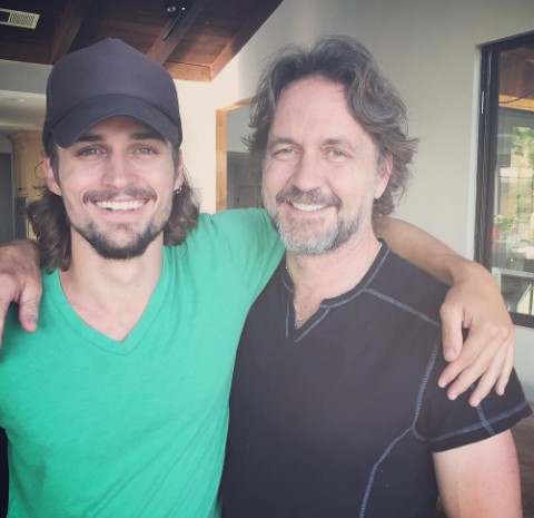 Picture of  Jon-Michael Ecker with his father Guy Ecker wearing green color t shirt and cap